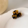 Mini cellulose acetate hair claw clip with classic tortoiseshell pattern on white plate - Dark Leopard
