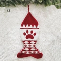 Detailed close-up of fish-shaped knit Christmas stocking with red paw pattern - Fish Shape-Paw Snowflake / Knitted Fish Stocking
