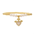 Golden bead and pearl bracelet with a winged zircon heart pendant on white background - White Heart Wing Style (2073YH)