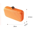 Orange woven evening clutch bag with dark metal twist lock and 20x12.5x5.5cm size guide - Orange