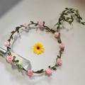 Detail of pink faux rose floral crown with green leaves and vine headband design - Pink