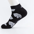 Cotton casual socks in black featuring stylized white robotic graphic on white foot model - EU Size 41-46 / Leopard Head Print