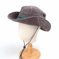 Detail of outdoor sun hat with wide brim, chin strap, and metal side buckles - Coffee