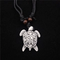 Resin sea turtle pendant necklace with tai chi yin yang pattern on black cord - White