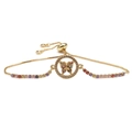Detail of adjustable gold bracelet featuring a butterfly charm with colorful zircons - Circle Hollow Butterfly