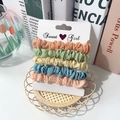 Lot de cinq chouchous en coton pastel orange, menthe et bleu sur carte de support - Élégant Uni