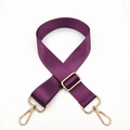 Detail of adjustable purple nylon shoulder strap with gold-tone swivel hooks and buckles - Deep purple