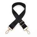 Detail of adjustable black nylon bag strap with polished gold hardware and swivel clips - Black