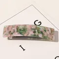 Détail de la pince à cheveux en acétate marbré rose et vert avec ressort métallique - Marbre Rose Vert
