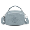 Light blue nylon crossbody bag with adjustable strap and multiple zipper compartments - Dayflower Blue