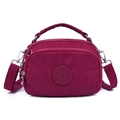 Deep red nylon crossbody bag with top handle and matching fabric shoulder strap - Deep Magenta