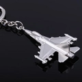 Macro shot of silver metal fighter jet keychain showing realistic wing details and finish - Modern Fighter Jet (飞机4)