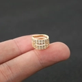 Detailed close-up of a four-layer gold ear cuff with sparkling pavé zircon stones - Size 7 / Gold