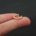 Detail of gold ear cuff with small white zircon stones in geometric rhombus design - Style 1 / Gold
