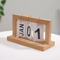 Minimalist wooden flip calendar with black metal rings and January cards for desk decor - Natural Wood Color