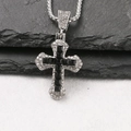 Close-up of a silver cross pendant with black square gemstones and micro-pave crystals - Black / Box Chain 60cm