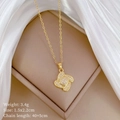 Macro shot of titanium steel clover necklace with crystal inlay on silk background - Necklace(C223)