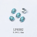 Detail view of retro alloy nail art charms with turquoise stones and blue rhinestones - Turquoise Blue Sapphire Alloy Charm (6502)