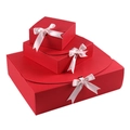 Three red gift boxes stacked with light pink ribbon bows in different sizes - Medium Box / Red