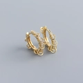 Detailed macro of gold S925 silver hoop earrings with micro-pave zircons and moving rings - Gold