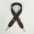 Detail of adjustable dark brown canvas strap with gold metal buckles and leather ends - Brown / Silver