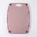 Large pink wheat straw cutting board with non-slip silicone feet and juice groove - Pink Large