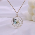 Bohemian gold necklace featuring a round glass pendant with dried flowers and a butterfly - Gold Yellow