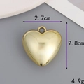 Detail view of a gold heart pendant showing dimensions of 2.7cm by 2.8cm and 4.9g weight - 27mm*28mm 3D Heart / Gold