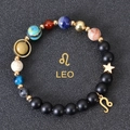 Detail of Leo constellation beaded bracelet with gold lion charm and planetary stones - Leo