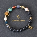 Detail of Capricorn beaded bracelet with matte black stones and colorful planet beads - Capricorn