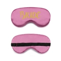 Pink satin eye mask with golden Bride lettering and adjustable black strap for weddings - Gold Foil Bride / Rose Red