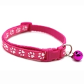 Close-up of pink pet collar featuring white paw prints with a buckle and purple bell - JY Paw Print / Rose Red