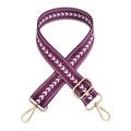 Detail of purple nylon strap with white arrow patterns and adjustable gold metal buckles - Deep purple