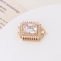 Macro shot of gold-plated square clasp with sparkling zircon stones for jewelry DIY - Gold-White