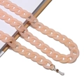 Detail of matte pink acrylic eyewear chain with golden loops and silicone ends - Flesh Pink