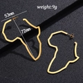 Detailed view of large gold African map earrings with size 53mm x 72mm on black texture - Height 72mm / Gold