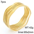 Detail view of 7pcs wavy gold titanium steel bangles with 65x2mm dimensions - 65mm / 7-Piece Set / Gold