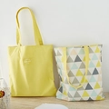 Dual-sided canvas tote bags in solid yellow and colorful geometric triangle patterns - Grey Yellow Triangle