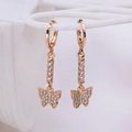 Elegant gold butterfly dangle earrings with clear zircon crystals on white grid stand - Butterfly