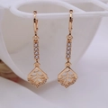 Detail of rose gold leaf drop earrings featuring hollow design and sparkling cubic zirconia - Leaf