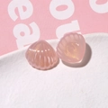 Macro shot of pink translucent seashell resin charms with gold glitter for DIY jewelry - Pink