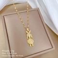 Detailed view of girl pendant necklace with diamonds on a beige jewelry box backdrop - Gold Rabbit Girl Style (B229)