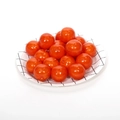 Miniature artificial red cherry tomatoes on a white grid plate for photography props - Mini Orange
