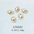 Gros plan sur strass en verre ovale 8,6x11,6mm avec perles et base en alliage - Grand Strass Transparent Base Or (6583)