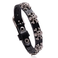 Bracciale punk in pelle nera regolabile con borchie metalliche a forma di teschio e ossa - Nero