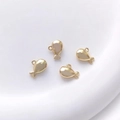 Close-up of four 14K gold-plated whale pendants for DIY jewelry making with mirror finish - 6# Cartoon Whale 9.8x7.5mm