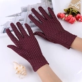 Detail view of burgundy wine lace gloves with white polka dots for sun protection - Polka Dot / Wine Red