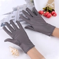 Detail view of gray sun protection gloves with white polka dots and stylish lace trim - Polka Dot / Dark Gray