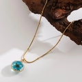 Vintage style gold titanium steel chain necklace featuring a blue dried flower resin pendant - |round-blue