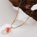 Elegant gold titanium steel necklace featuring a real red dried flower in round pendant - |round-pink